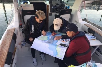 Boaties learning on a vessel